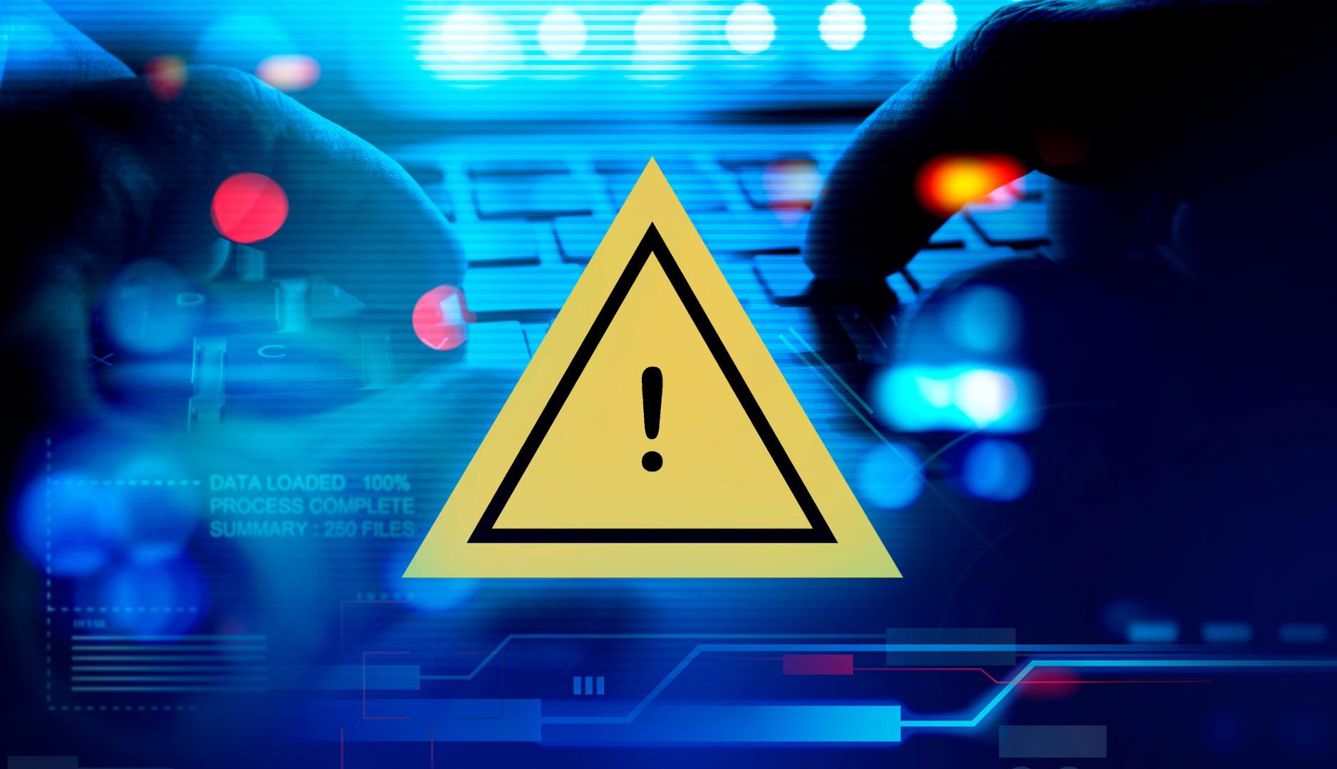 Image of man at a laptop building a proactive cybersecurity posture while utilizing TRaViS to manage vulnerabilities.
