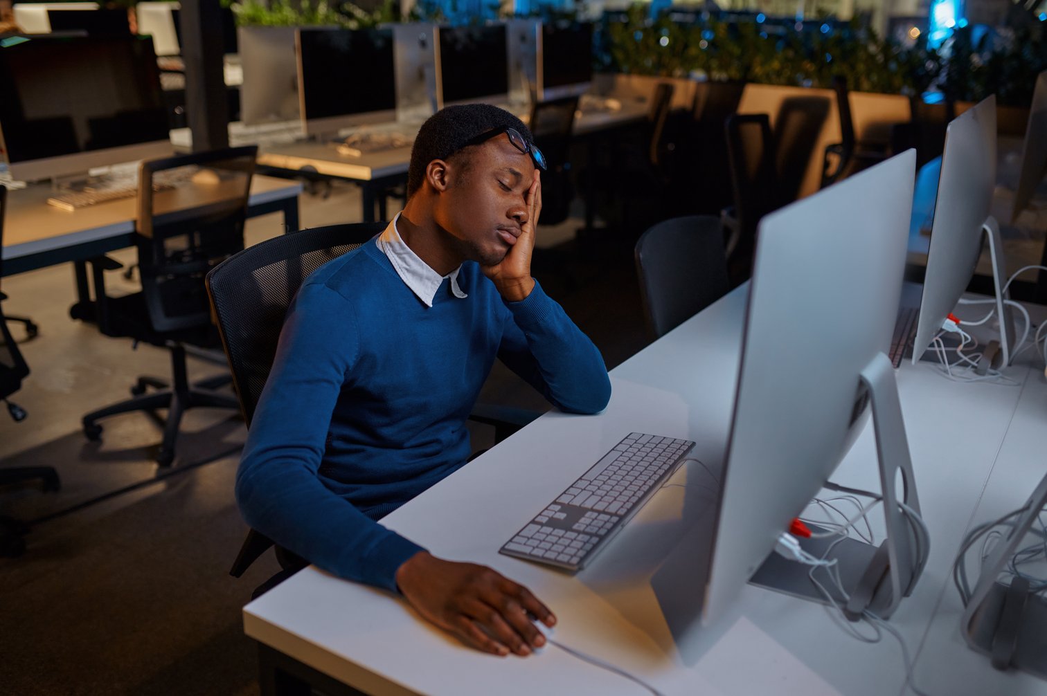 Shadow IT isn't going anywhere. Image of man a computer wondering why his company doesn't use TRaViS yet. TRaViS stands for threat recon and vulnerability management sysmtem.