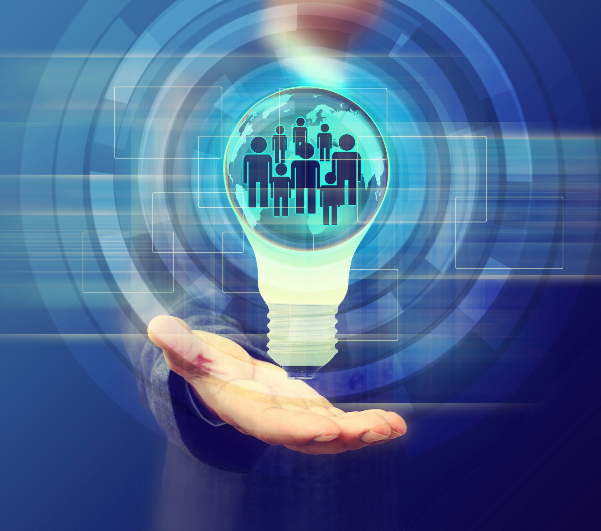 Hand holding digital lightbulb with network icons representing TRaViS EASM strengthening vulnerability management and external attack surface visibility.