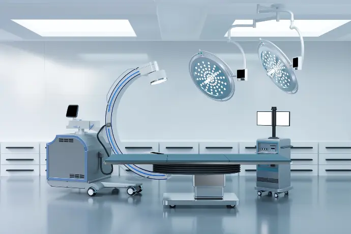 Healthcare organization operating room with TRaViS ASM cybersecurity tool for scaling medical system security, adjusting patient data monitoring, and managing health records.