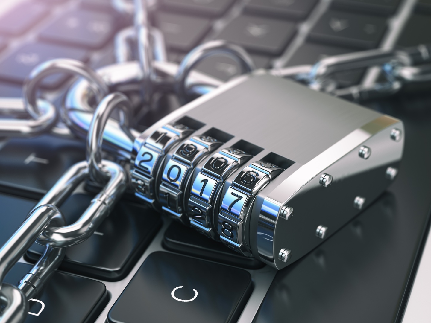 Addressing SOC Manager Challenges with TRaViS ASM Security Solutions Combination lock on a keyboard secured with chains, symbolizing SOC managers' challenges and secure solutions with TRaViS ASM.