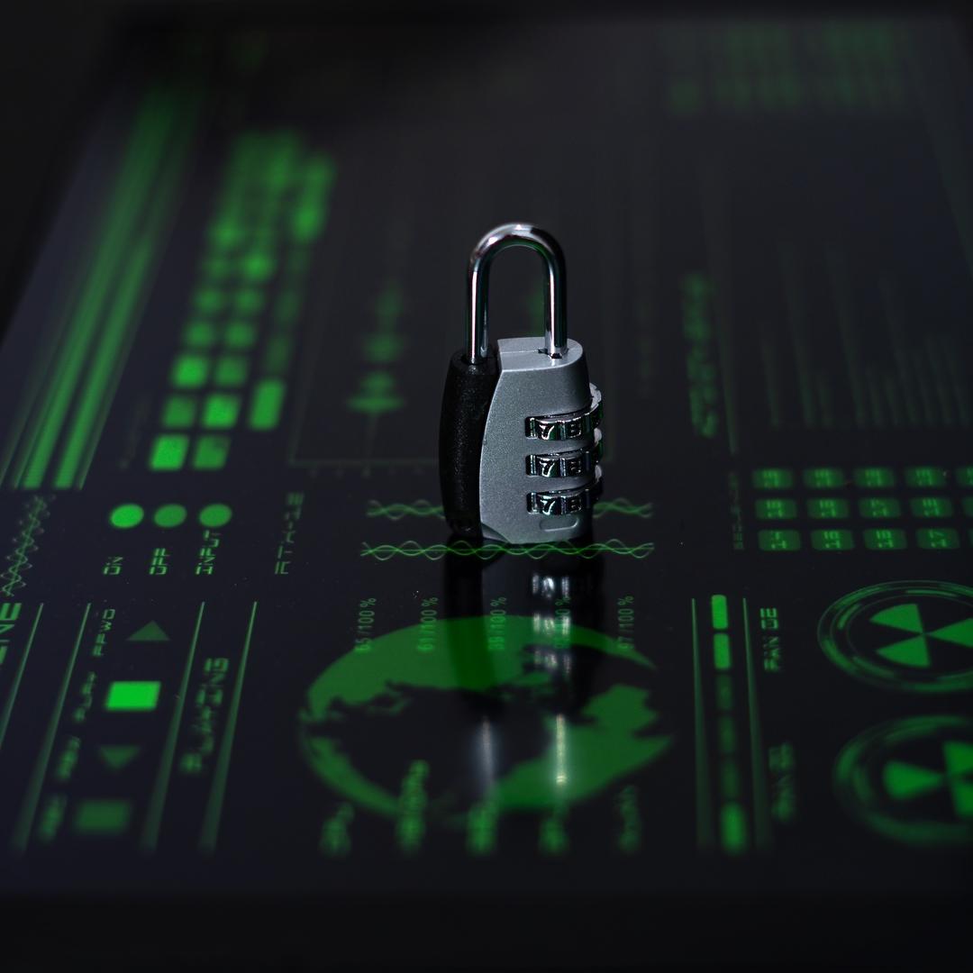 Strengthen Cybersecurity with TRaViS EASM for Comprehensive Digital Protection Combination lock placed on a digital interface, symbolizing cybersecurity protection.